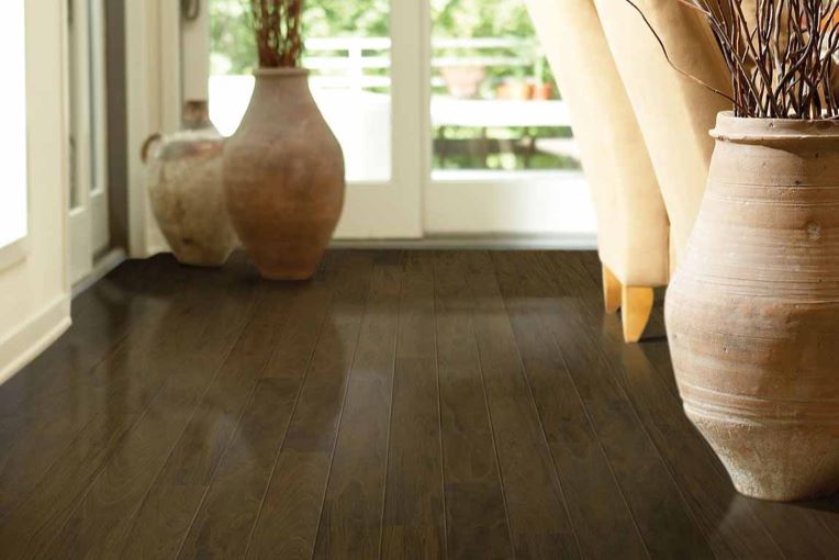 dark stained wood look laminate flooring in a earth toned dining room